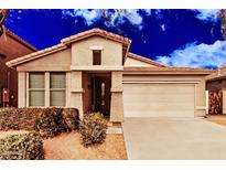 Inviting single-Gathering home with a two-car garage, desert landscaping, and a covered entrance at 2242 W Calle Marita --, Phoenix, AZ 85085