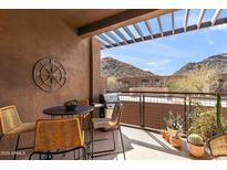 Relaxing patio featuring a dining table and chairs with mountain views, perfect for outdoor entertaining and enjoying scenic vistas at 36600 N Cave Creek Rd # 9B, Cave Creek, AZ 85331