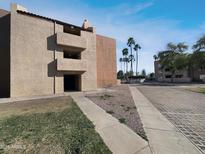 Exterior shot of building facade with desert landscaping and sunny blue sky at 540 N May -- # 3131, Mesa, AZ 85201