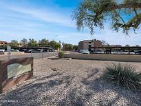 Exterior shot of the community grounds, landscaping, parking, and building exteriors on a sunny day at 540 N May -- # 3131, Mesa, AZ 85201