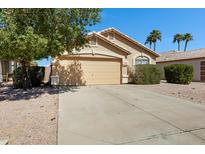 Lovely one-story home with desert landscaping, a two-car garage, and a charming, well-kept front yard at 2056 E Saratoga St, Gilbert, AZ 85296