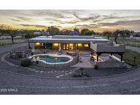 Stunning home with a private pool, outdoor kitchen, and beautiful sunset views at 39657 N Foxtail Ln, San Tan Valley, AZ 85140