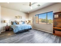 Bright bedroom featuring a large window with views and stylish decor at 4553 S Alamos Way, Gold Canyon, AZ 85118