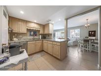 Bright kitchen with light wood cabinets, tile floors, and neutral countertops providing an inviting space at 5429 N 78Th St, Scottsdale, AZ 85250