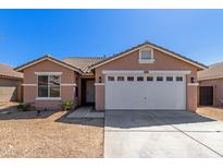 Charming single-story home featuring a two-car garage, desert landscaping, and a classic tile roof on a sunny day at 6619 W Whyman Ave, Phoenix, AZ 85043