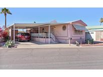 Charming single-level home featuring a covered carport, front porch and landscaped yard at 701 S Dobson Rd # 432, Mesa, AZ 85202