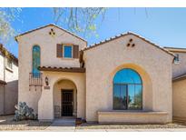 Charming stucco home featuring an arched window and decorative accents at 8429 W Vernon Ave, Phoenix, AZ 85037