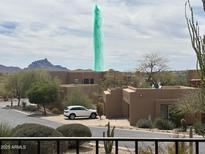 Day view of the community with desert landscaping, fountain and architecture at 13013 N Panorama Dr # 120, Fountain Hills, AZ 85268