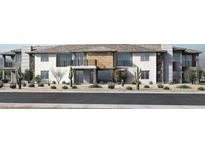 Contemporary townhome showcases stone and stucco facade, a private balcony, and desert landscaping at 2121 W Sonoran Desert Dr # 126, Phoenix, AZ 85085