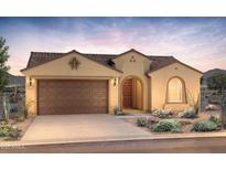 Inviting single-story home featuring a two-car garage, covered entry, and desert landscaping at 21287 N 272Nd Ln, Buckeye, AZ 85396