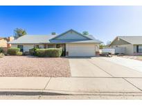 Charming single-story home featuring a two-car garage, low maintenance desert landscaping, and a well-maintained exterior at 4335 E Downing St, Mesa, AZ 85205