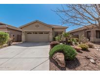 Charming single-story home with desert landscaping and a spacious two-car garage at 44215 W Granite Dr, Maricopa, AZ 85139