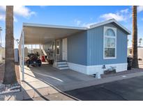 Charming single-story home with a covered carport and easy access parking space at 7807 E Main St # E-38, Mesa, AZ 85207