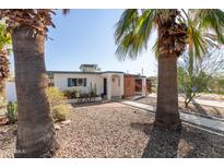 Charming single-story home featuring a desert-friendly landscaped front yard and a quaint patio area at 825 W 12Th St, Tempe, AZ 85281