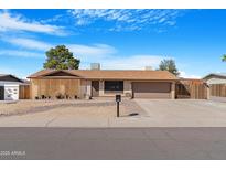 Charming single-story home featuring a two-car garage and low-maintenance landscaping at 1604 W Kerry Ln, Phoenix, AZ 85027