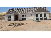 Under-construction single-Gathering home with newly installed windows at 1800 W Caramel Ct, Queen Creek, AZ 85144