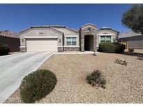 Charming single-story home with neutral stucco, stone accents, and a well-maintained desert landscape at 30116 W Fairmount Ave, Buckeye, AZ 85396