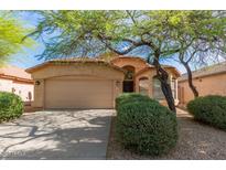 Charming single-story home featuring desert landscaping and a two-car garage at 4708 E Weaver Rd, Phoenix, AZ 85050