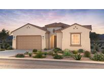 Inviting single-story home with desert landscaping, neutral tones, and a tile roof provides curb appeal at 657 W Rock Needle Trl, Apache Junction, AZ 85120