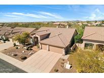 Beautiful desert home featuring mature landscaping, tile roof and three car garage at 7444 E Sand Hills Rd, Scottsdale, AZ 85255