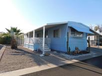 Charming single-story home with a covered porch, desert landscaping, and a well-maintained exterior at 8600 E Broadway Rd # 22, Mesa, AZ 85208