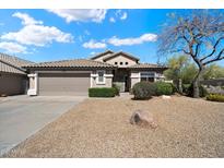 Charming single story home with a two car garage and low maintenance desert landscaping at 10588 E Tierra Buena Ln, Scottsdale, AZ 85255