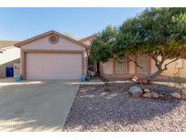 Charming single-Gathering home with a well-maintained front yard and a two-car garage, bathed in warm sunlight at 1871 E Westchester Dr, Chandler, AZ 85249