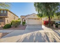 Charming single-story home featuring a two-car garage, desert landscaping, and a welcoming entryway at 3890 S Star Canyon Dr, Gilbert, AZ 85297