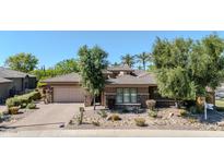 Beautiful single-story home featuring desert landscaping, a tile roof, and a two-car garage at 5206 S Fairchild Ln, Chandler, AZ 85249