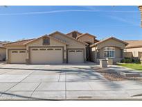 Attractive single-Gathering home with a three-car garage and well-manicured lawn, offering curb appeal at 859 E Teakwood Dr, Chandler, AZ 85249