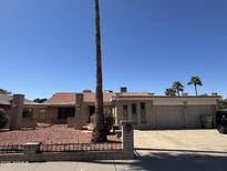 Charming single-story home with a brick exterior, two-car garage, well-manicured yard, and desert landscaping at 8632 N 48 Dr, Glendale, AZ 85302