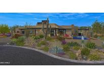 Striking contemporary home with desert landscaping and a sparkling pool at 10354 E Celestial Dr, Scottsdale, AZ 85262