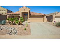 Charming single-story home with desert landscaping, tile roof, and two-car garage in a desirable location at 22499 N Dietz Dr, Maricopa, AZ 85138