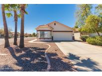 Charming single-story home with a well-manicured front yard and a two-car garage at 39894 N Fazio Ln, San Tan Valley, AZ 85140