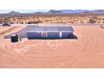 Impressive aerial view of a single-story desert home with expansive land at 50426 W Wildwood Rd, Maricopa, AZ 85139