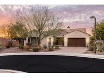 Charming single-Gathering home with a well-manicured desert landscape, two-car garage and beautiful desert sunset at 5448 E Windstone Trl, Cave Creek, AZ 85331