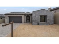 Charming single story home featuring gray stone driveway and tile roof at 12326 E Black Rock Rd, Scottsdale, AZ 85255