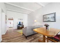 Bright and spacious living room with wood floors and an open layout, perfect for modern living at 13409 N Emberwood Dr, Sun City, AZ 85351