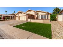 Charming single-Gathering home featuring well-manicured lawn and a three-car garage at 2718 E Bighorn Ave, Phoenix, AZ 85048