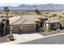 Expansive desert home boasts a three car garage, gravel landscaping and a scenic mountain view backdrop at 2813 W Hiddenview Dr, Phoenix, AZ 85045