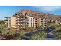 Stunning exterior view of condos with mountain views and desert landscaping in a vibrant community at 4849 N Camelback Ridge Rd # B104, Scottsdale, AZ 85251