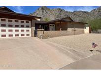 Charming home with a desert landscape and mountain views, featuring a spacious driveway and two-car garage at 6808 N 26Th St, Phoenix, AZ 85016