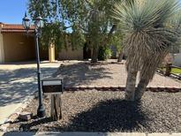 Charming front yard featuring desert landscaping and a well-maintained exterior of this lovely home at 12639 N 113Th Dr, Youngtown, AZ 85363