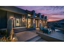 Stunning outdoor patio with luxurious seating and ambient lighting, perfect for evening relaxation and scenic enjoyment at 1805 E Rocky Slope Dr, Phoenix, AZ 85048