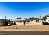 Charming single-story home featuring a well-maintained yard and classic architectural details at 3338 W Palmaire Ave, Phoenix, AZ 85051