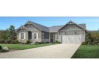 Charming single-story home with board and batten siding, a two-car garage and professionally landscaped front yard at 3483 W Sunstone Dr, San Tan Valley, AZ 85144