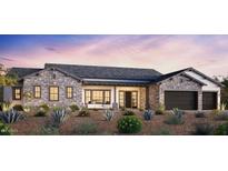 Beautiful single-story home featuring a stone facade, two-car garage, and desert landscaping at 4329 S Parkcrest St, Gilbert, AZ 85297