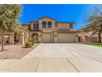 Stunning two-story home featuring a three-car garage and meticulously manicured landscaping at 4725 N 152Nd Dr, Goodyear, AZ 85395