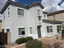 Charming two-story home featuring a gray stucco exterior and well-maintained landscaping at 4786 E Laurel Ct, Gilbert, AZ 85234