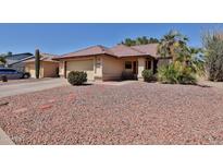 Charming single-story home with red rock landscaping and a well-maintained tile roof at 5358 E Glencove St, Mesa, AZ 85205